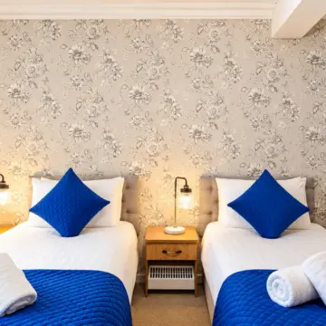 Symmetrical Blue-Accented Twin Bedroom
