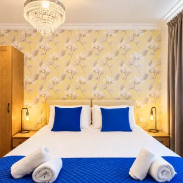 Symmetrical Blue and Gold Hotel Bedroom (1)