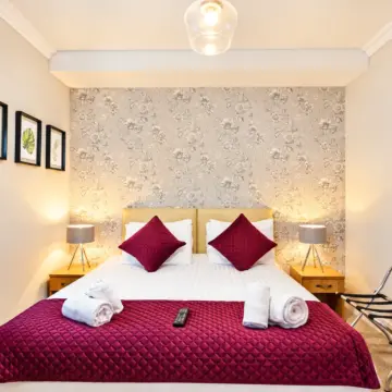 Symmetrical Burgundy Hotel Bedroom