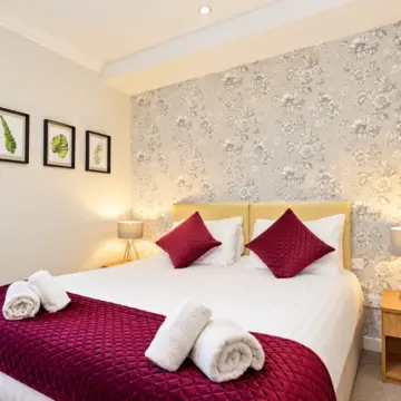 Warm Boutique Bedroom with Burgundy Accents