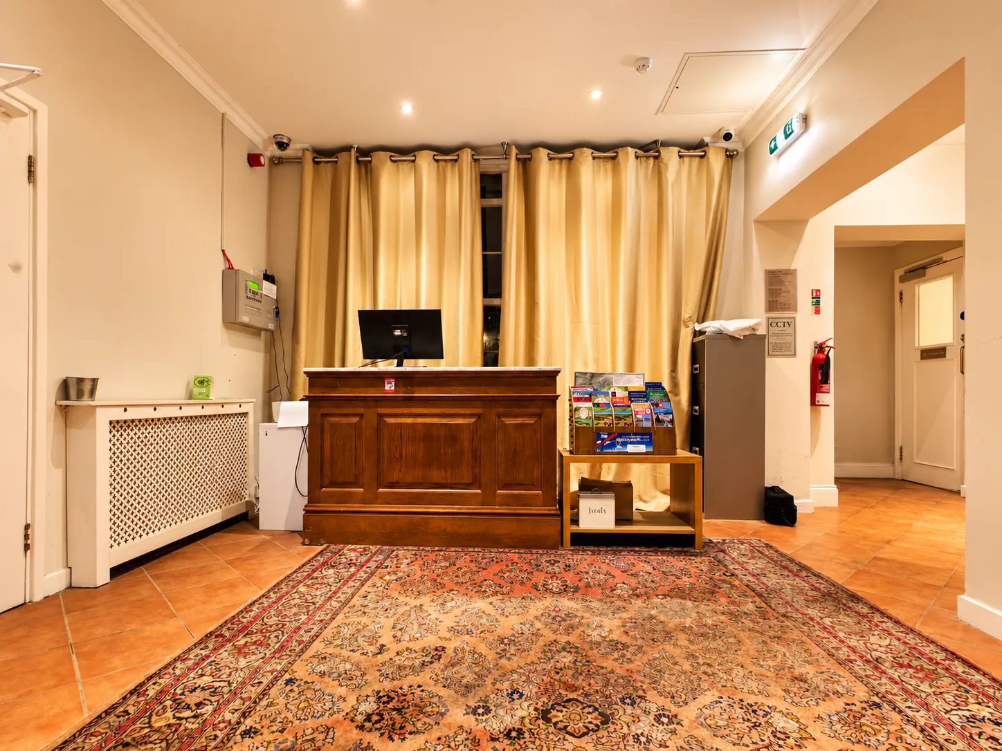 Warm Hotel Reception with Brochure Stand